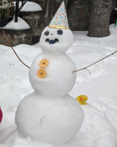making a snowman with toddler