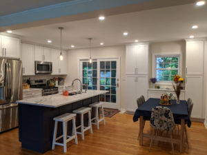 the completed kitchen renovation project, white and blue cabinets